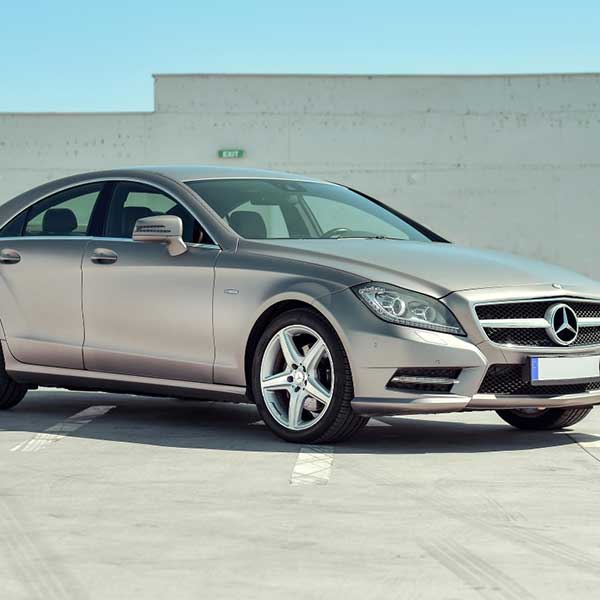 A Mercedes in an open-ground parking zone in the DFW Metroplex

