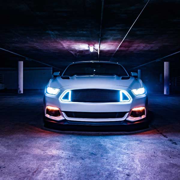 A Mustang is parked inside a parking zone in the DFW Metroplex
