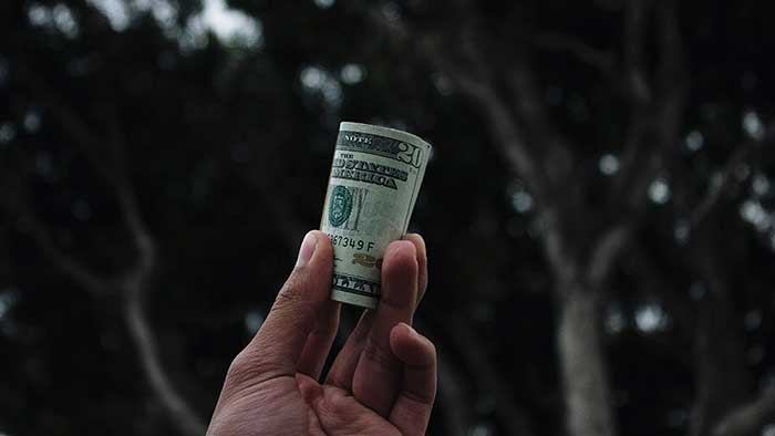 Man holding a currency note