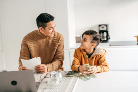 Father and son budgeting.