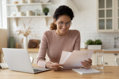 Woman looking over tax return.