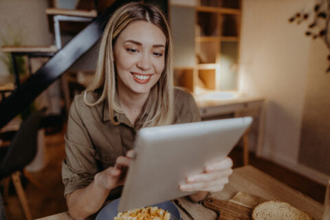 Young woman using her tablet for title loan in texas