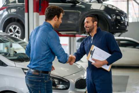 A man at the car repair shop.