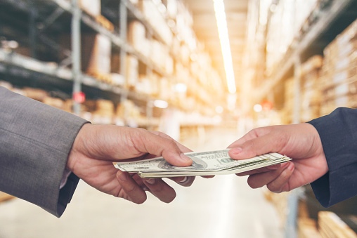 Man is borrowing money from another man