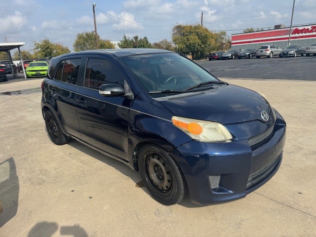 Blue 2008 Scion XD parked in a parking lot in the DFW Metroplex