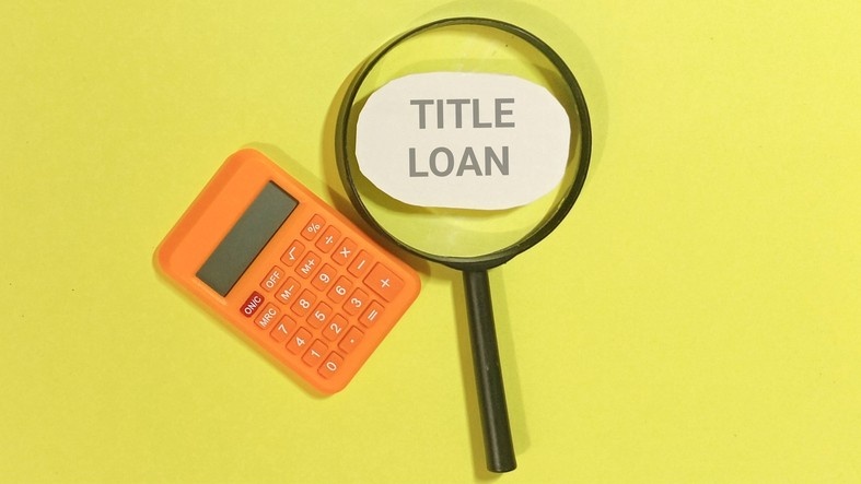 A title loan calculator with a magnifying glass on a yellow background in the DFW Metroplex